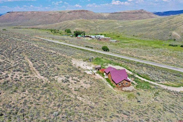 mountain view featuring a rural view