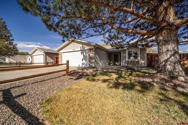 ranch-style house featuring a garage