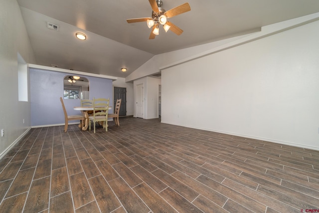 unfurnished living room with lofted ceiling, dark hardwood / wood-style flooring, and ceiling fan