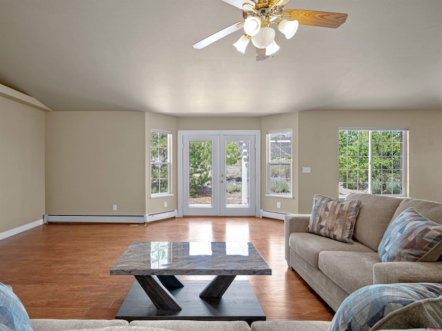 living room featuring a baseboard radiator, french doors, and light wood-type flooring