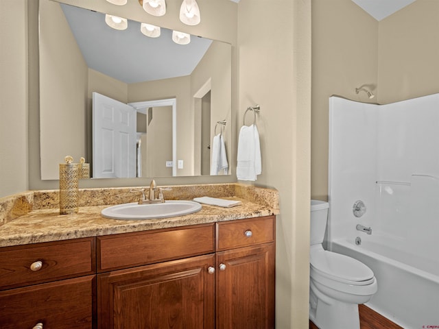 full bathroom featuring bathtub / shower combination, vanity, and toilet