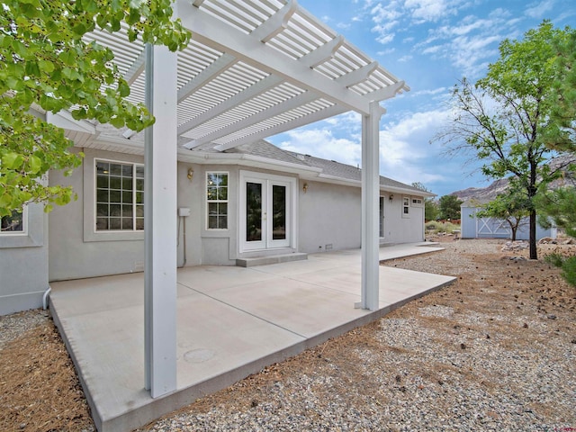 view of patio / terrace featuring french doors and a pergola