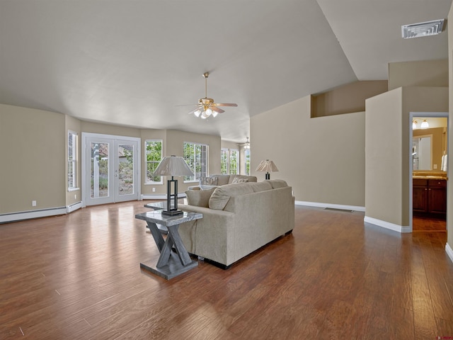 living room featuring french doors, wood-type flooring, vaulted ceiling, and baseboard heating