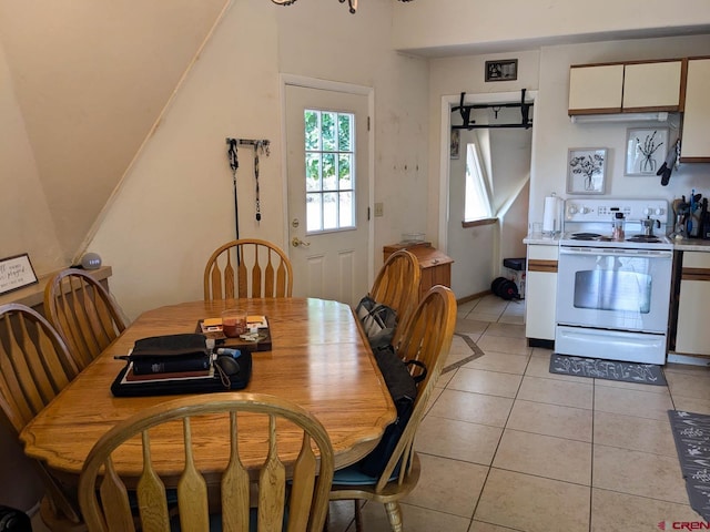 dining area with light tile patterned floors