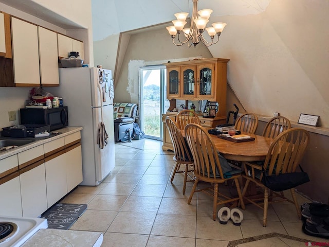 dining area with an inviting chandelier and light tile patterned floors