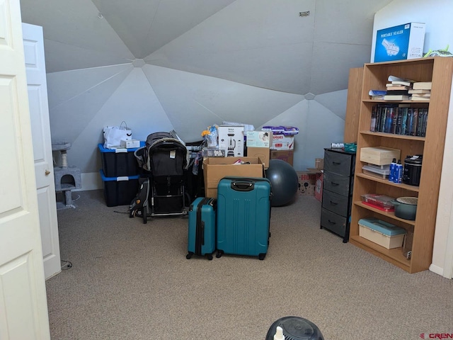 office area featuring light carpet and lofted ceiling