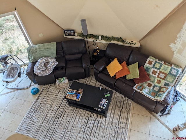 tiled living room featuring lofted ceiling