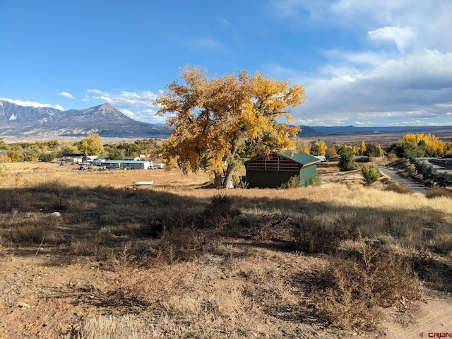 view of mountain feature with a rural view