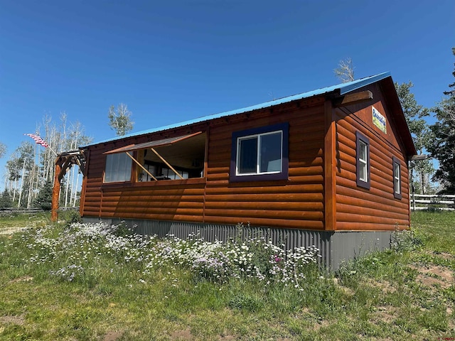 19958 Fs 327th Loop, Mancos, CO 81328 - view of side of home featuring log veneer siding and metal roof