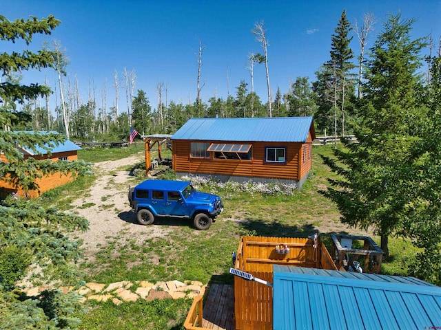 19958 Fs 327th Loop, Mancos, CO 81328 - exterior space with log veneer siding and metal roof