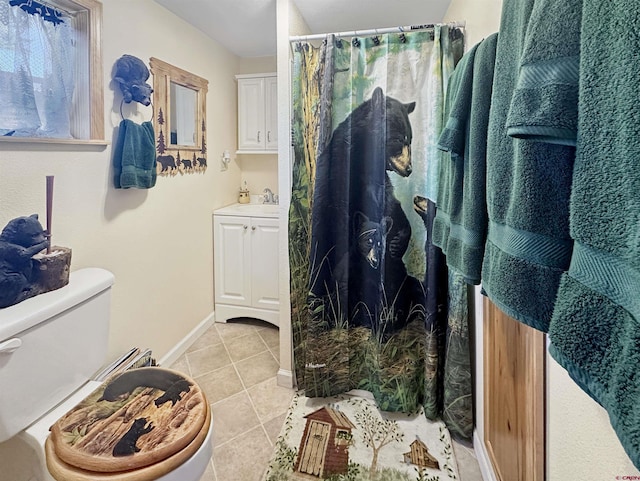 19958 Fs 327th Loop, Mancos, CO 81328 - bathroom featuring vanity, baseboards, curtained shower, tile patterned floors, and toilet