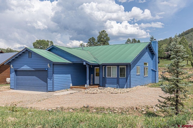 single story home featuring a garage