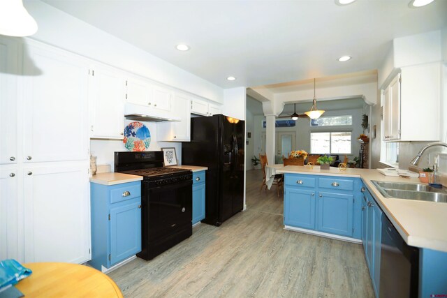 kitchen featuring black appliances, light hardwood / wood-style floors, white cabinets, and sink