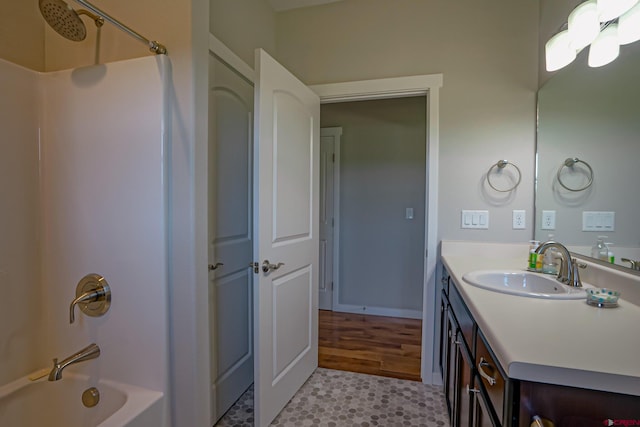 bathroom with bathing tub / shower combination and vanity