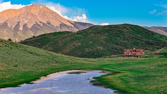 property view of mountains featuring a water view