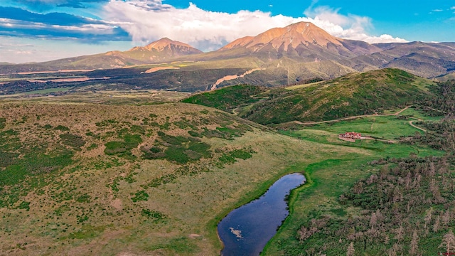 view of mountain feature with a water view