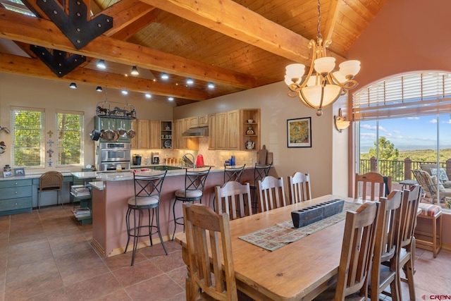 tiled dining space with beam ceiling, wood ceiling, and a chandelier