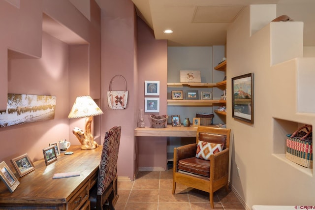 tiled office space featuring built in desk