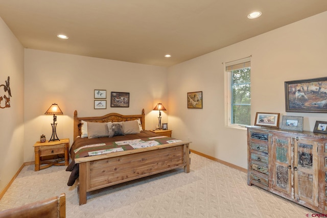 bedroom featuring light colored carpet