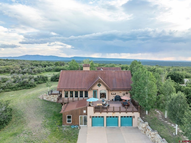 drone / aerial view featuring a mountain view