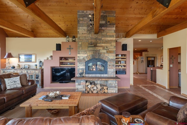 tiled living room with beamed ceiling, a fireplace, and wood ceiling