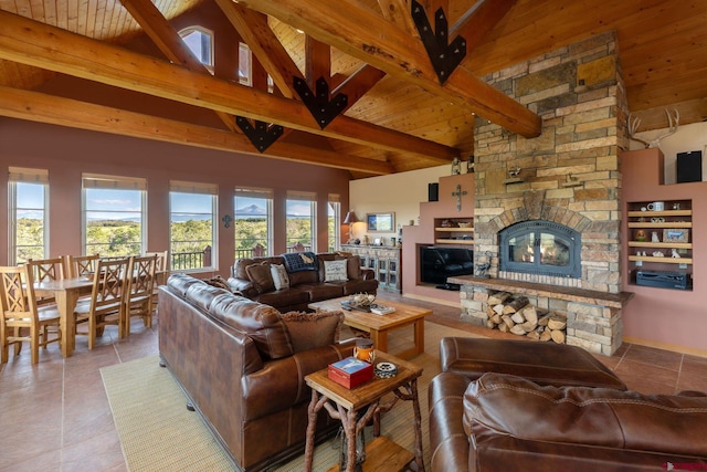 tiled living room featuring beamed ceiling, a stone fireplace, high vaulted ceiling, and wood ceiling