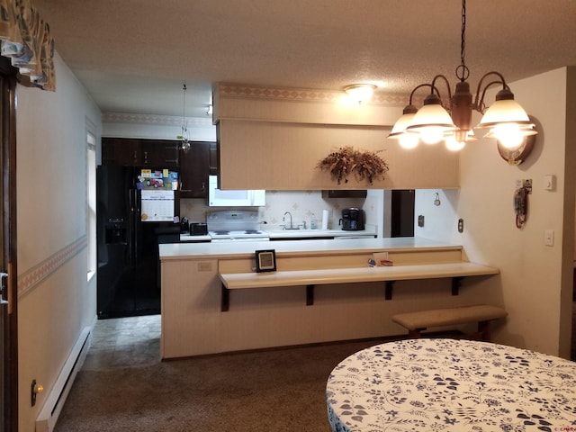 kitchen featuring a baseboard heating unit, white appliances, a notable chandelier, kitchen peninsula, and a breakfast bar