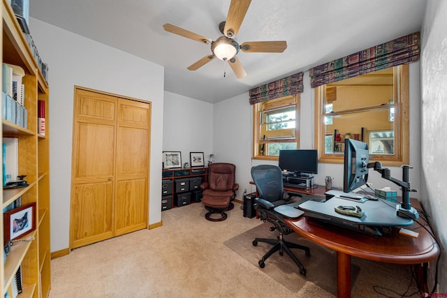 office featuring ceiling fan and light colored carpet