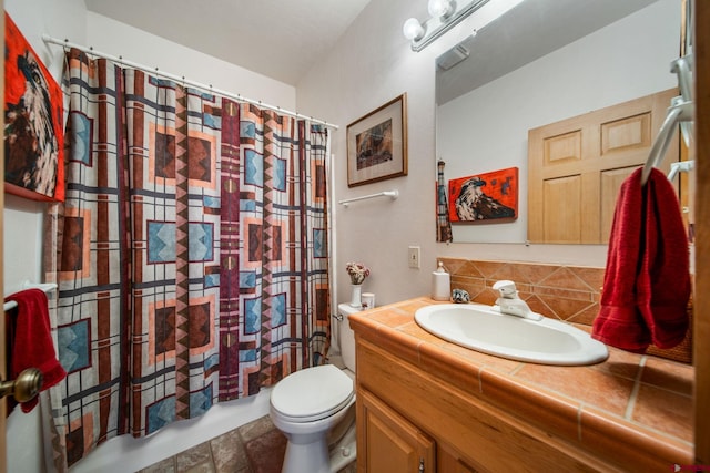 full bathroom with tile patterned flooring, tasteful backsplash, shower / bath combination with curtain, toilet, and vanity