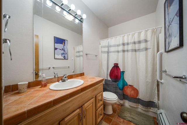 bathroom featuring vanity, tile patterned floors, a baseboard heating unit, and toilet