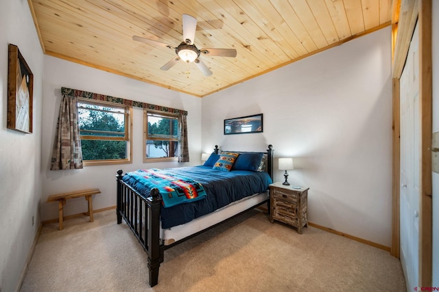 carpeted bedroom featuring wood ceiling, ceiling fan, and a closet