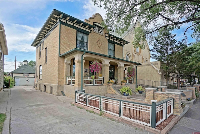 view of front of house featuring a garage and a porch