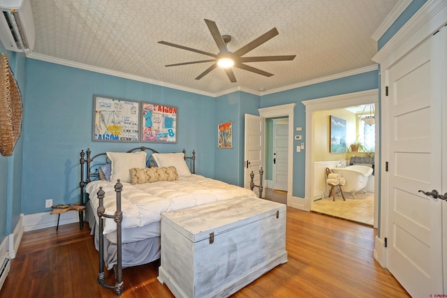 bedroom featuring ceiling fan, ornamental molding, a wall mounted AC, and hardwood / wood-style flooring