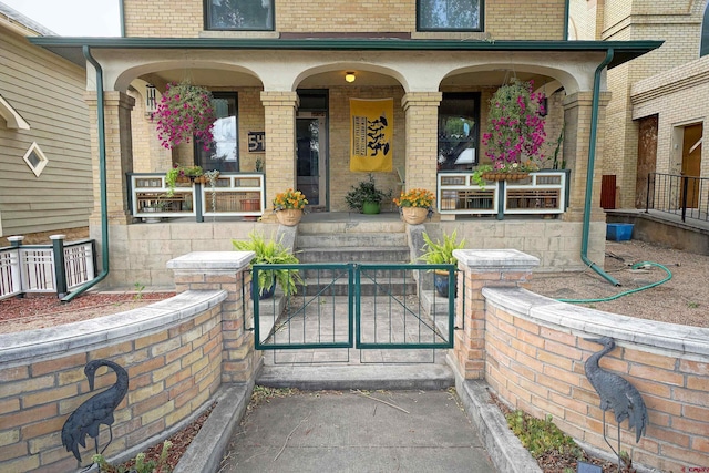 view of exterior entry featuring a porch