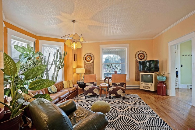 living room featuring a wealth of natural light, crown molding, and a notable chandelier