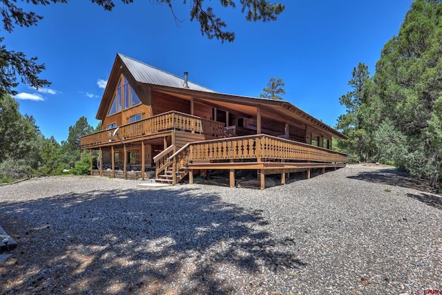 rear view of property with a deck