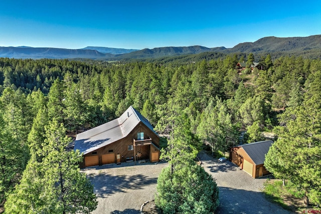 birds eye view of property with a mountain view