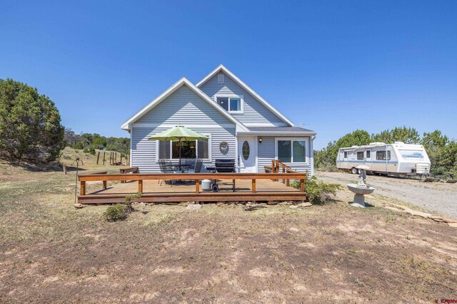 view of front of house with a wooden deck