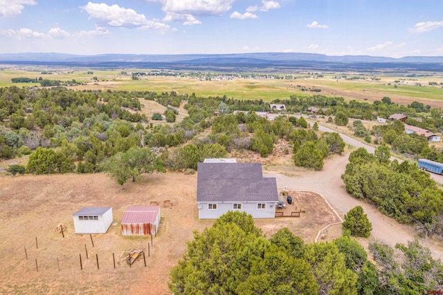 aerial view with a mountain view and a rural view