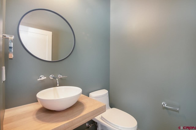 bathroom with sink and toilet