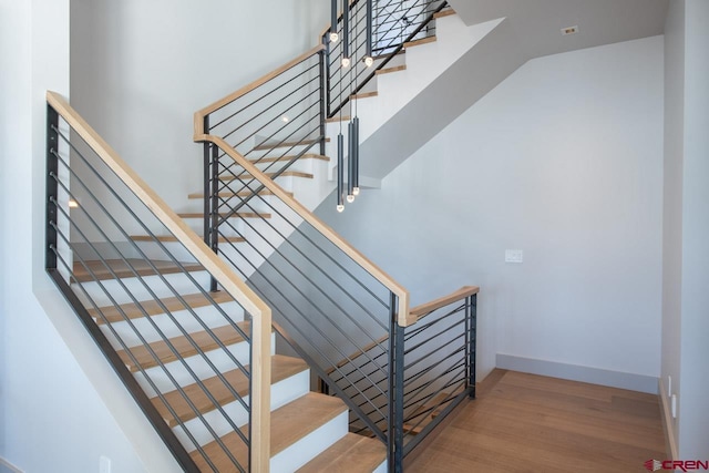 stairway featuring hardwood / wood-style floors