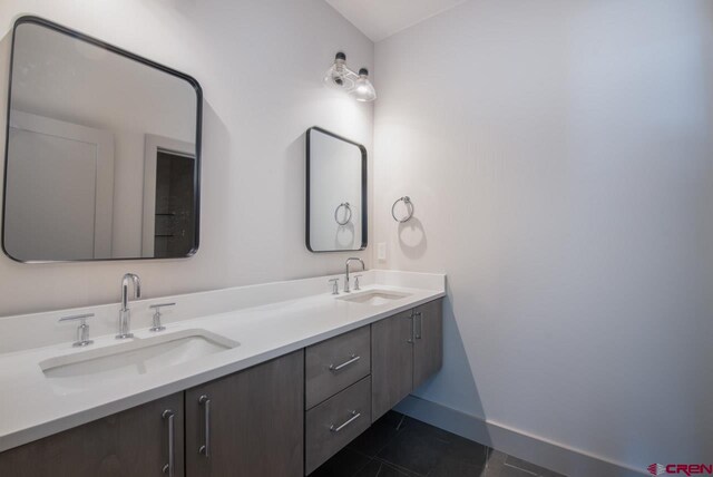 bathroom featuring tile patterned floors and vanity