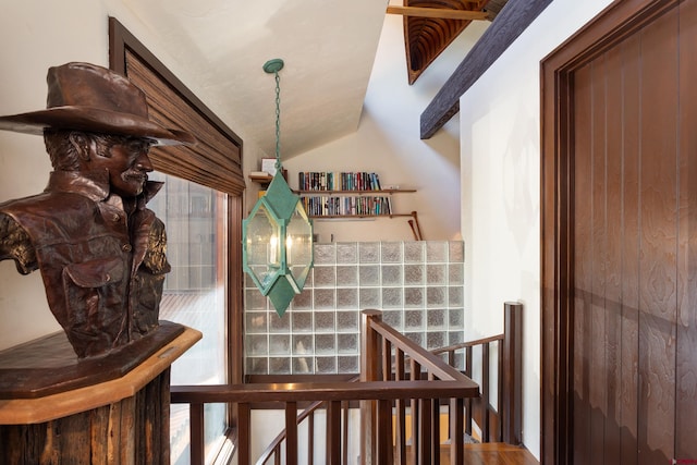 staircase with lofted ceiling