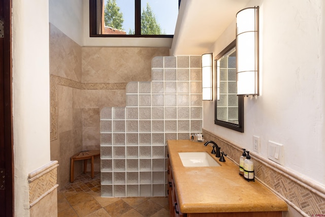 bathroom featuring vanity, tile walls, and tile patterned floors