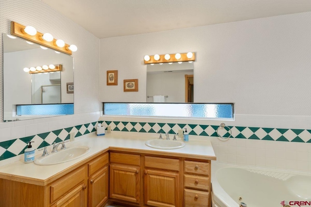 bathroom with vanity, a bathtub, and backsplash