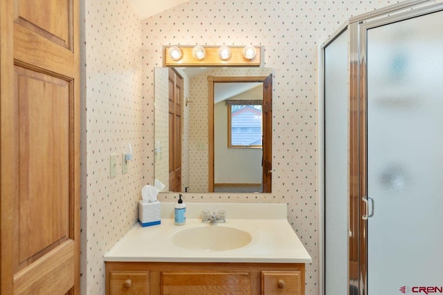 bathroom with vanity and vaulted ceiling