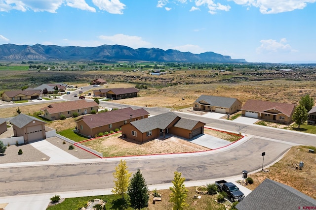 bird's eye view featuring a residential view and a mountain view