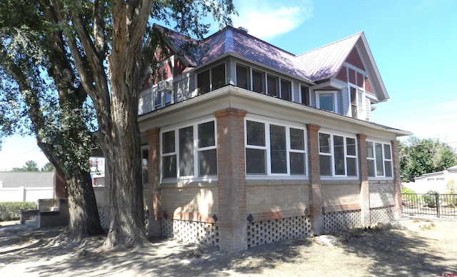 view of home's exterior featuring a sunroom