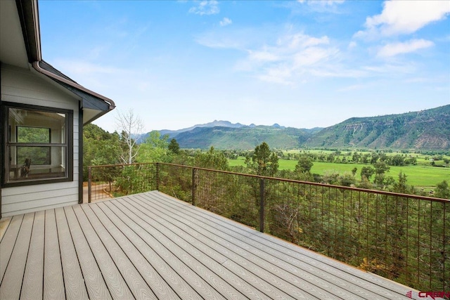 wooden terrace with a mountain view