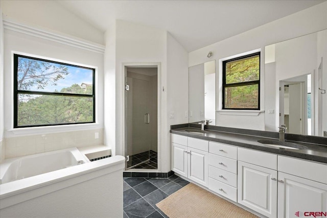 bathroom featuring vanity, tile patterned flooring, lofted ceiling, and separate shower and tub